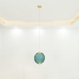 modern-circular-glass-pendant-light-with-brass-finish-and-integrated-led-spotlight