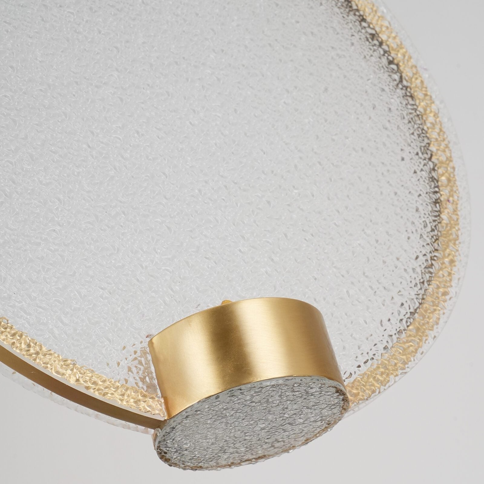 modern-circular-glass-pendant-light-with-brass-finish-and-integrated-led-spotlight