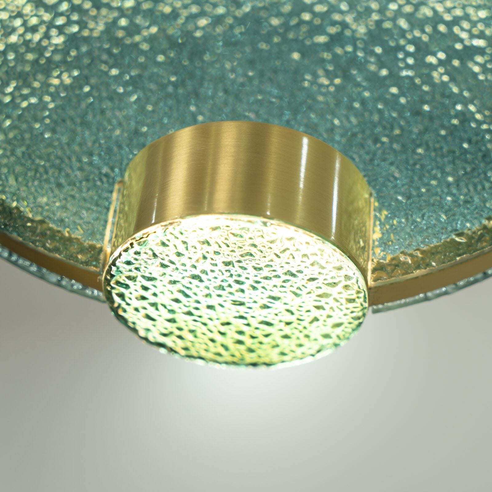 modern-circular-glass-pendant-light-with-brass-finish-and-integrated-led-spotlight