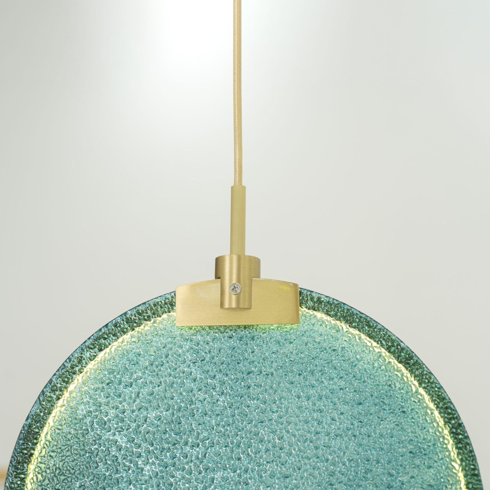modern-circular-glass-pendant-light-with-brass-finish-and-integrated-led-spotlight