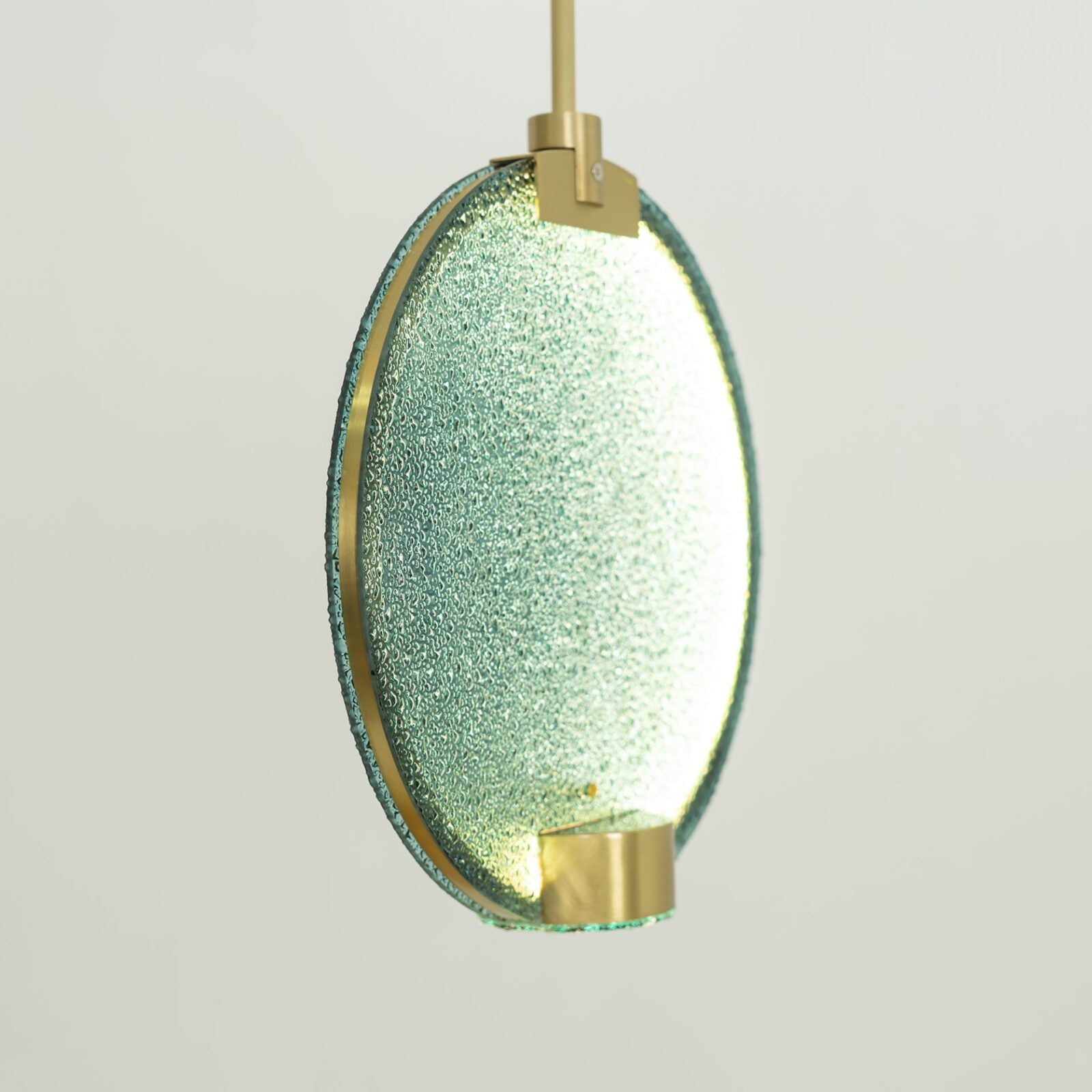 modern-circular-glass-pendant-light-with-brass-finish-and-integrated-led-spotlight