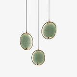 modern-circular-glass-pendant-light-with-brass-finish-and-integrated-led-spotlight