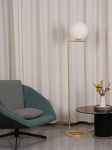 modern-industrial-gold-standing-lamp-with-white-glass-globe-shade-and-foot-switch