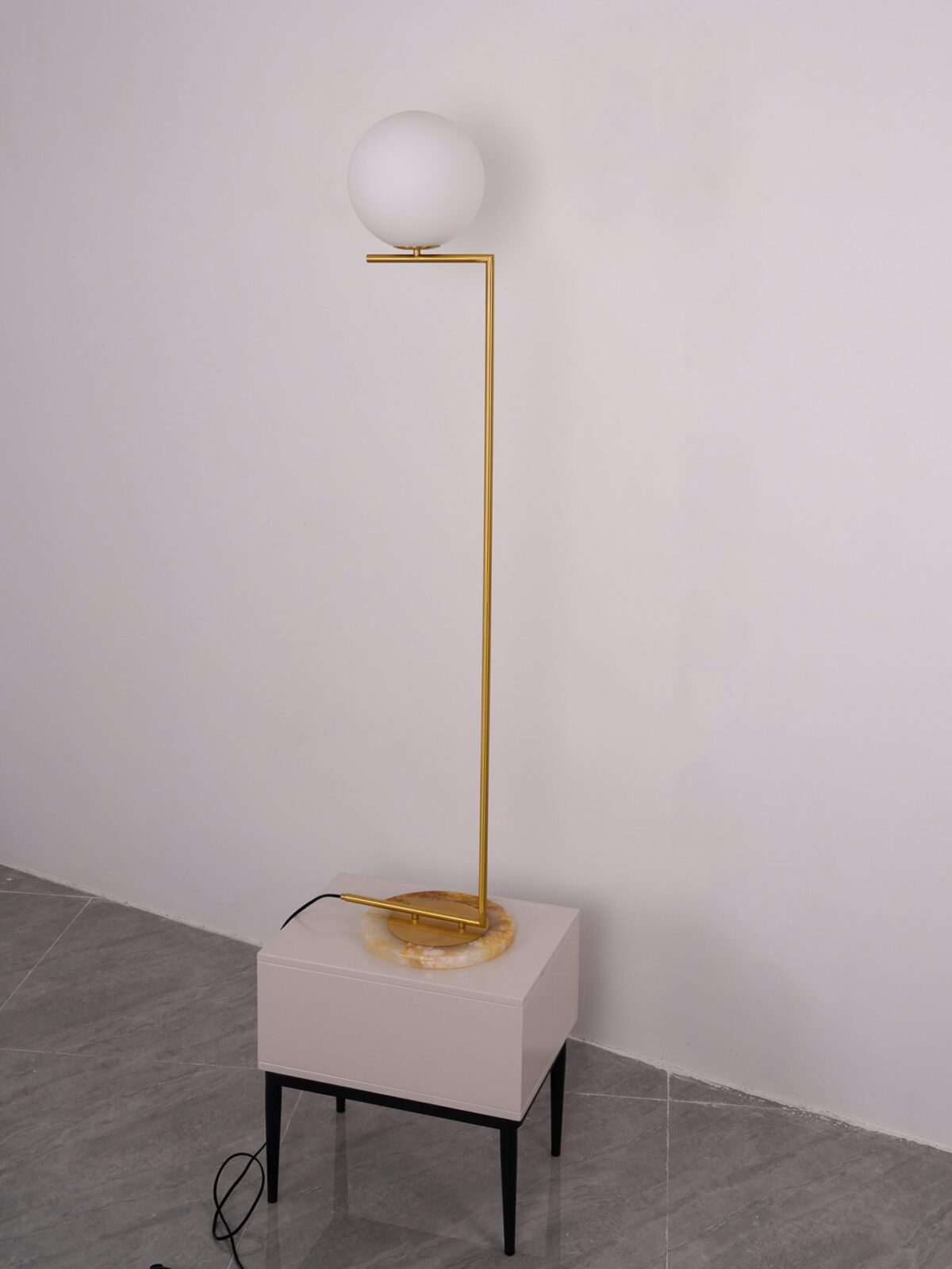 modern-industrial-gold-standing-lamp-with-white-glass-globe-shade-and-foot-switch