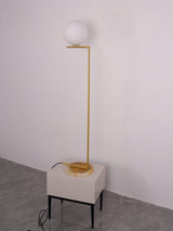 modern-industrial-gold-standing-lamp-with-white-glass-globe-shade-and-foot-switch