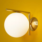 modern-opal-blown-glass-wall-sconce-with-elegant-brass-finish-round-globe-lighting
