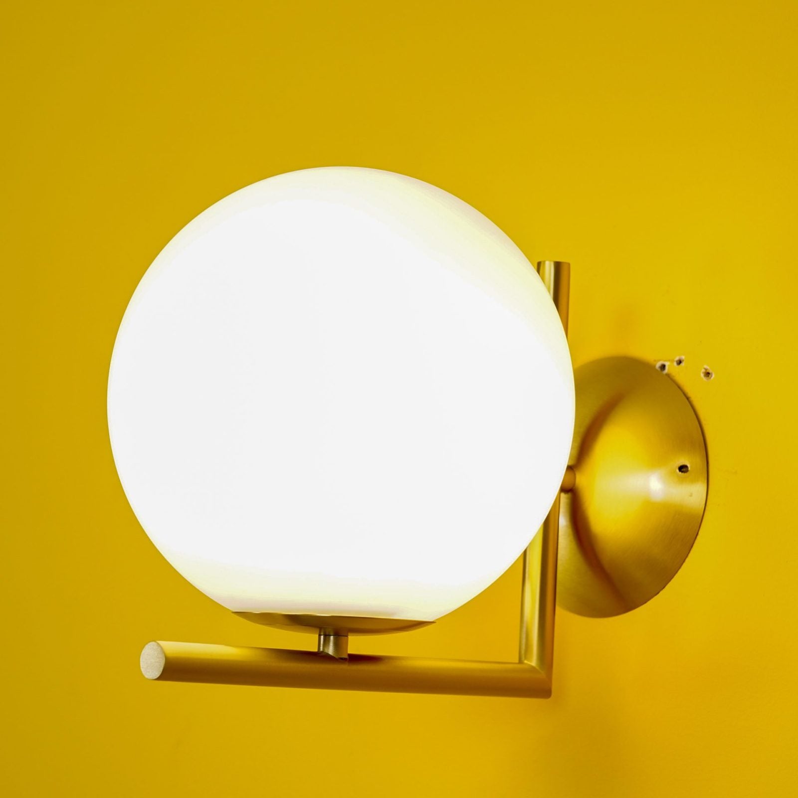modern-opal-blown-glass-wall-sconce-with-elegant-brass-finish-round-globe-lighting