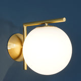 modern-opal-blown-glass-wall-sconce-with-elegant-brass-finish-round-globe-lighting