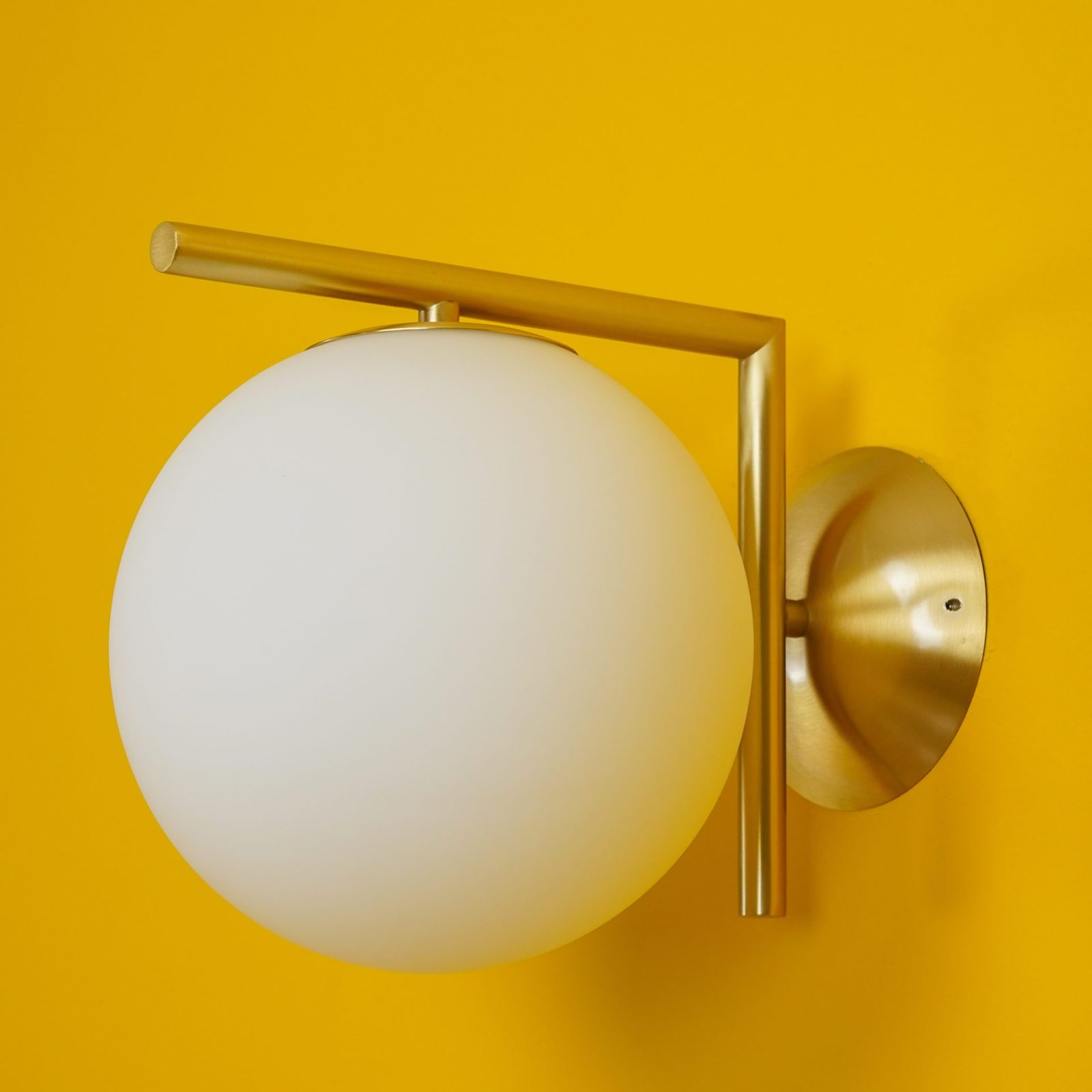modern-opal-blown-glass-wall-sconce-with-elegant-brass-finish-round-globe-lighting