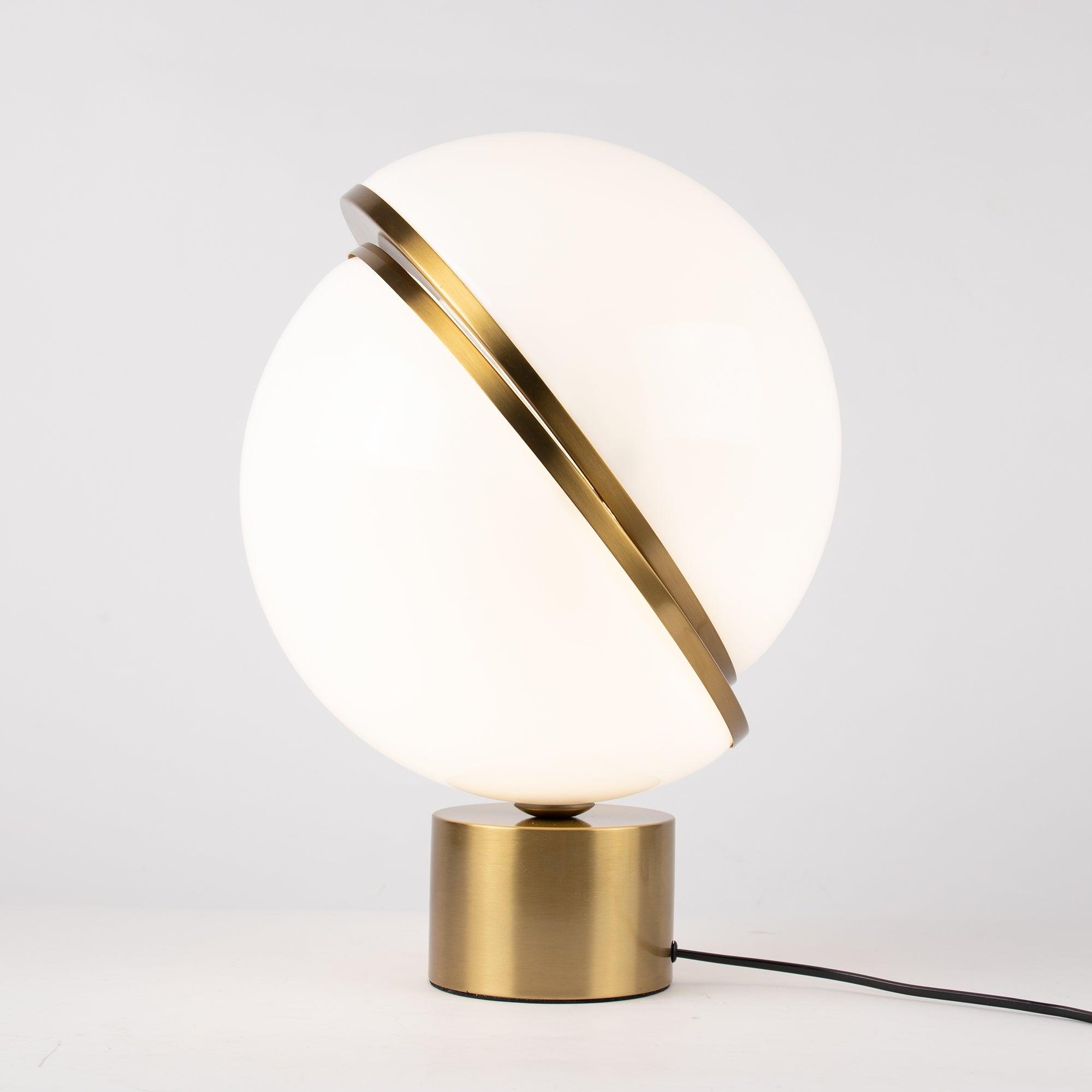 modern-asymmetrical-crescent-table-lamp-with-gold-interior-and-acrylic-globe