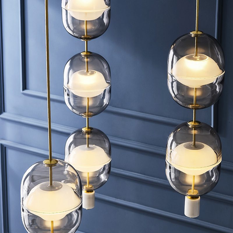 inder-nordic-glass-capsule-pendant-light-with-white-marble-and-metal-accents
