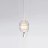 inder-nordic-glass-capsule-pendant-light-with-white-marble-and-metal-accents