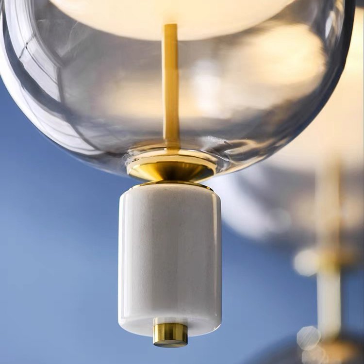 inder-nordic-glass-capsule-pendant-light-with-white-marble-and-metal-accents