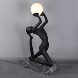 modern-artistic-human-figure-floor-lamp-with-luminous-glass-globe-sphere