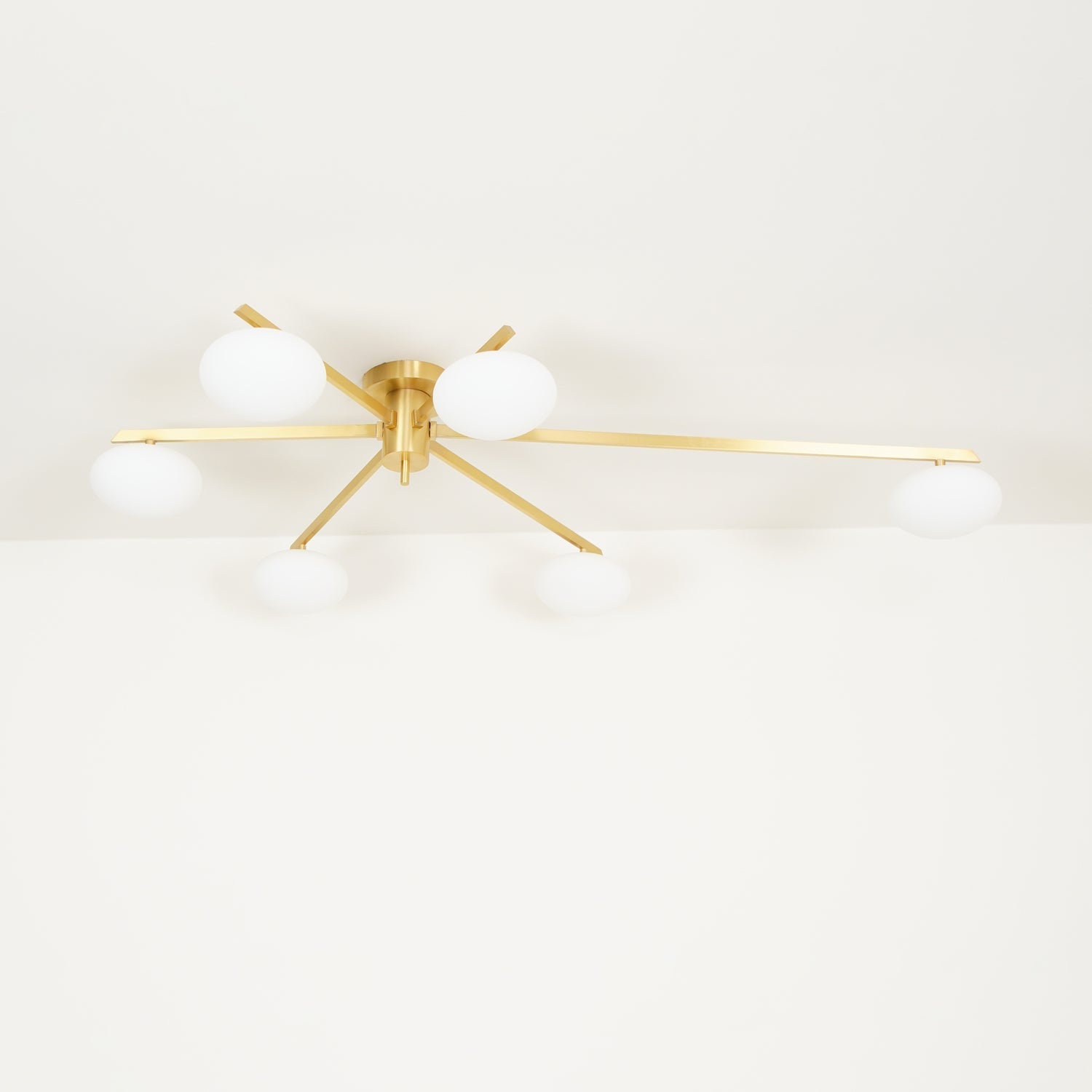 modern-jasper-glass-globe-ceiling-light-with-minimalist-metal-arms-and-oval-bulbs