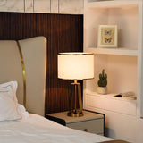 Laila Antique Gold Table Lamp with Ivory Fabric Shade and Curved Metal Base