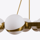modern-brass-sputnik-chandelier-with-opaline-glass-spheres-for-dining-room