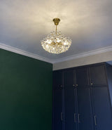 polished-brass-crystal-jewel-chandelier-modern-glass-pendant-light-for-elegant-interiors