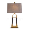 elegant-leather-texture-table-lamp-with-gold-metal-base-and-linen-shade