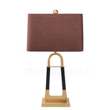 elegant-leather-texture-table-lamp-with-gold-metal-base-and-linen-shade