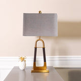 elegant-leather-texture-table-lamp-with-gold-metal-base-and-linen-shade