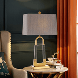 elegant-leather-texture-table-lamp-with-gold-metal-base-and-linen-shade