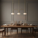 mid-century-modern-looping-brass-pendant-light-with-white-blown-glass-globes