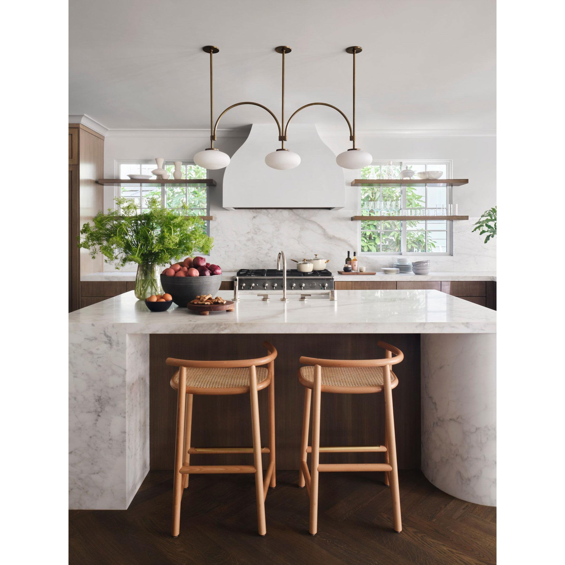 mid-century-modern-looping-brass-pendant-light-with-white-blown-glass-globes