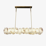 modern-brass-and-natural-white-alabaster-led-chandelier-for-luxury-dining-spaces