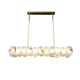 modern-brass-and-natural-white-alabaster-led-chandelier-for-luxury-dining-spaces