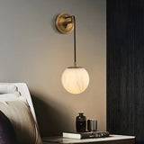 modern-alabaster-globe-wall-sconce-with-brass-accents-elegant-spherical-indoor-light