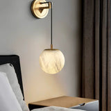 modern-alabaster-globe-wall-sconce-with-brass-accents-elegant-spherical-indoor-light