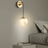 modern-alabaster-globe-wall-sconce-with-brass-accents-elegant-spherical-indoor-light