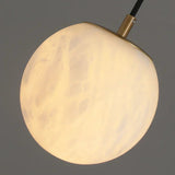 modern-alabaster-globe-wall-sconce-with-brass-accents-elegant-spherical-indoor-light