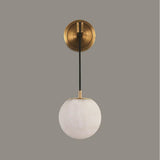 modern-alabaster-globe-wall-sconce-with-brass-accents-elegant-spherical-indoor-light