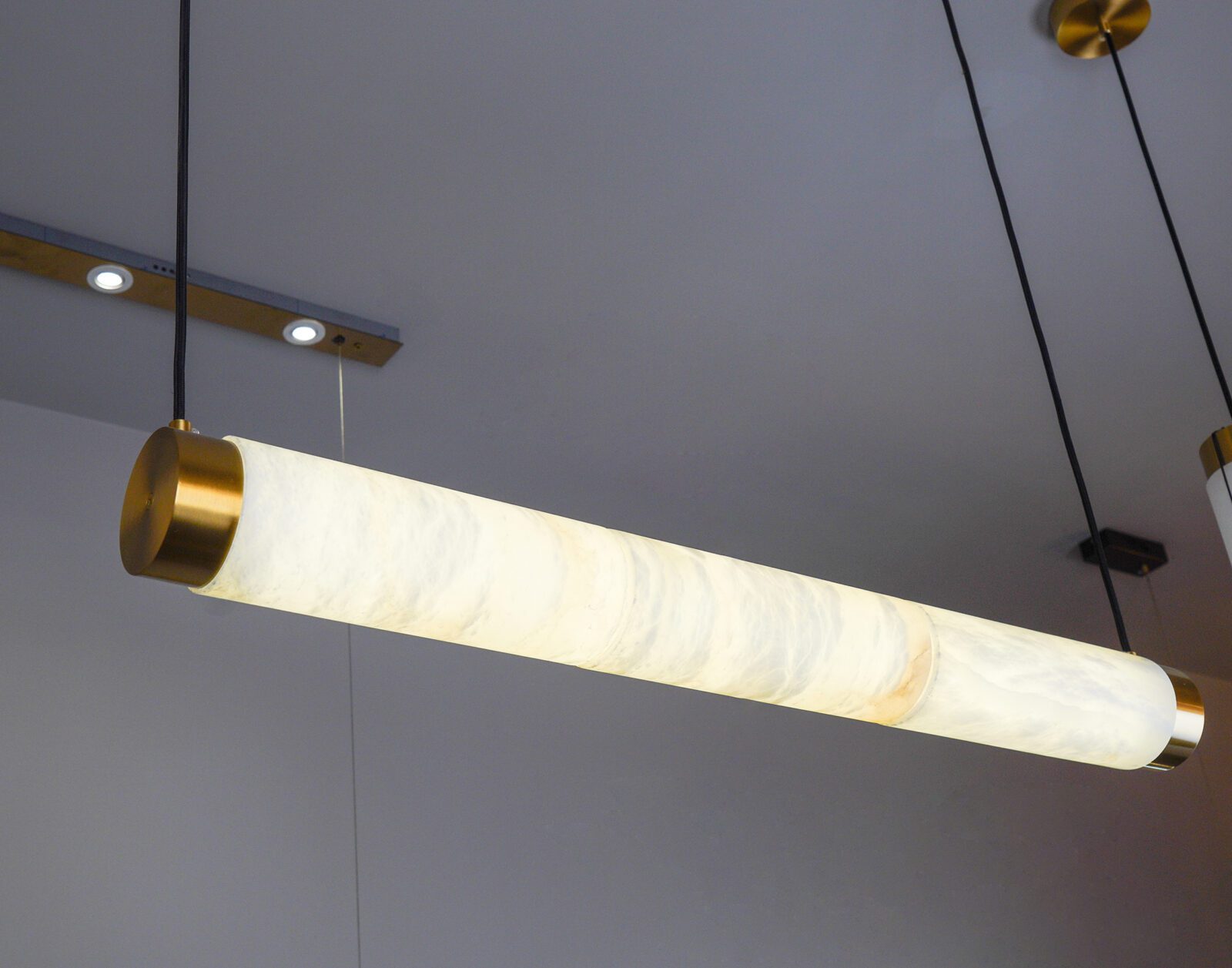modern-natural-marble-strip-led-pendant-light-with-brass-accents-for-contemporary-interiors