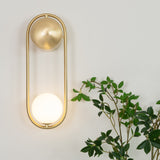 modern-mila-glass-globe-wall-sconce-brass-minimalist-interior-lighting-fixture