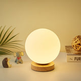 minimalist-mini-moon-wooden-desk-lamp-with-white-glass-globe-shade-for-bedside