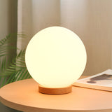 minimalist-mini-moon-wooden-desk-lamp-with-white-glass-globe-shade-for-bedside