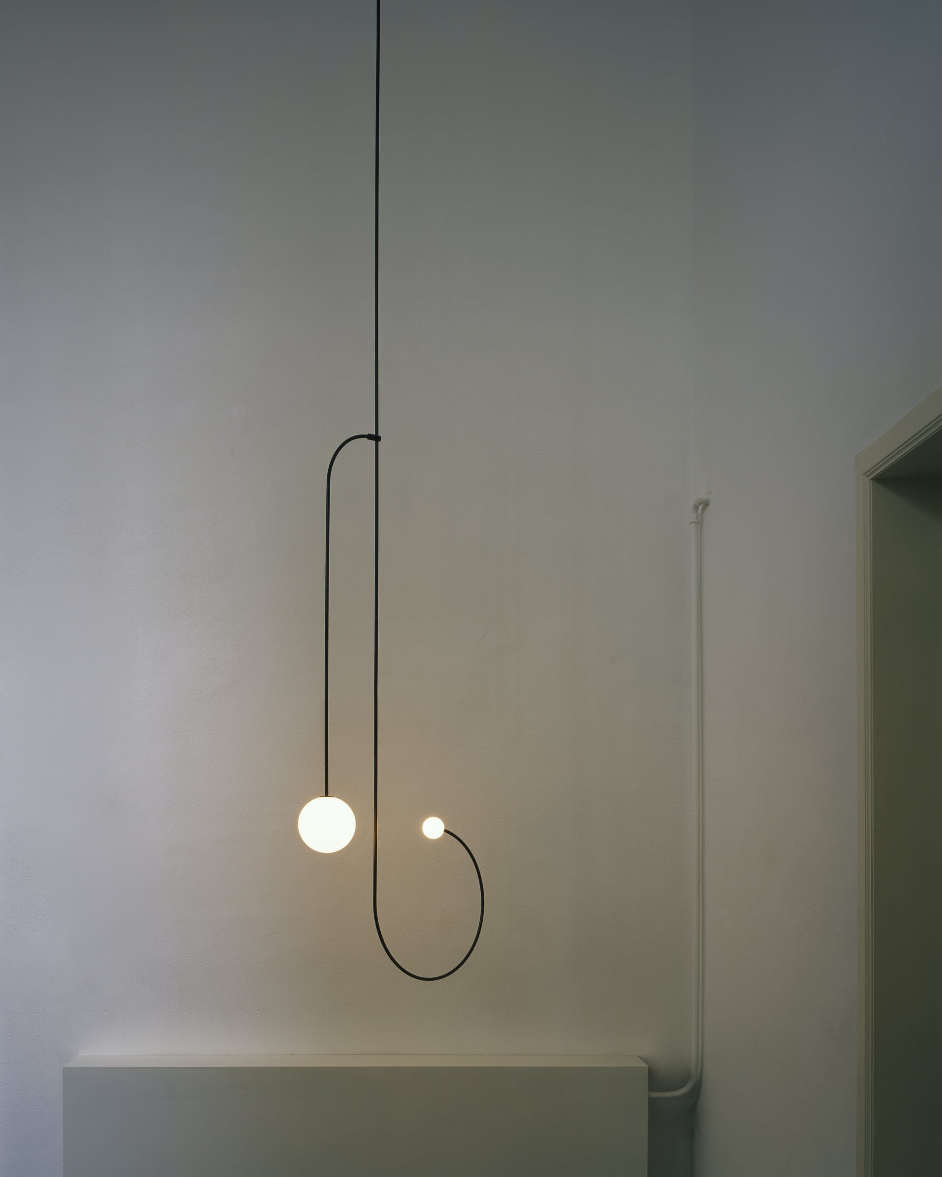 Modern Minimalist Linear Mobile Chandelier with Opal Glass Globes and Black Finish
