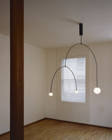 Modern Minimalist Linear Mobile Chandelier with Opal Glass Globes and Black Finish