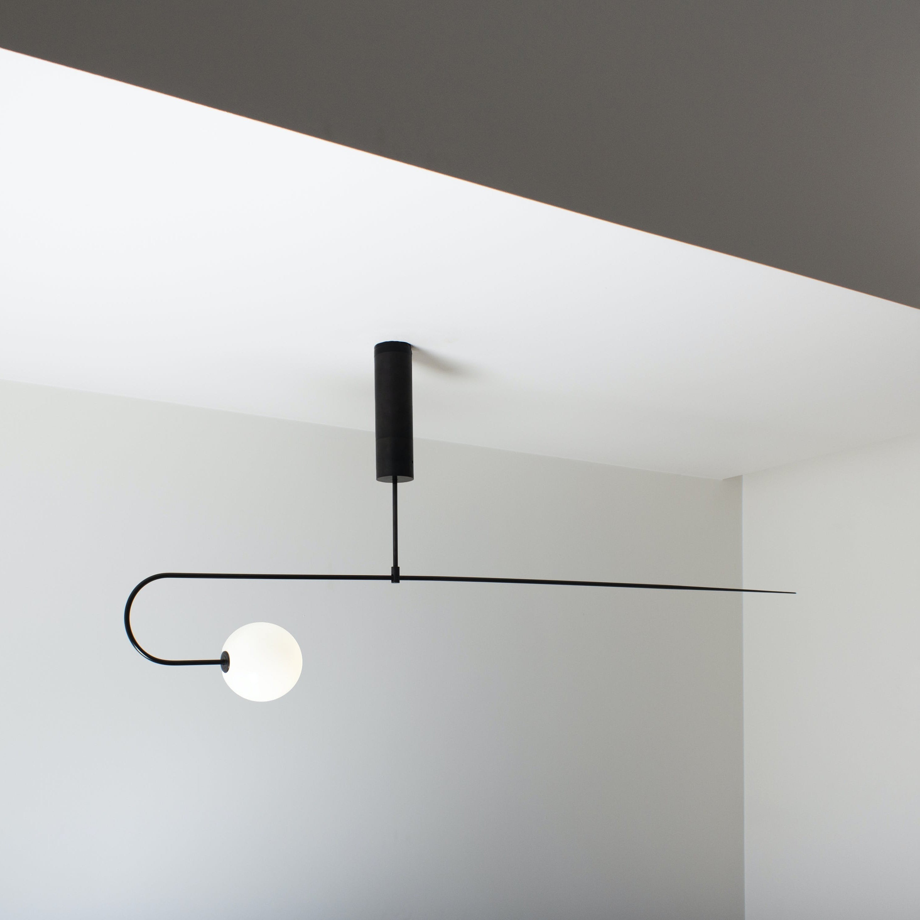 Modern Minimalist Linear Mobile Chandelier with Opal Glass Globes and Black Finish