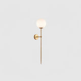 modern-brass-and-opal-glass-sphere-mobile-wall-sconce-lighting-for-indoor-spaces