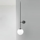modern-brass-and-opal-glass-sphere-mobile-wall-sconce-lighting-for-indoor-spaces