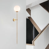 modern-brass-and-opal-glass-sphere-mobile-wall-sconce-lighting-for-indoor-spaces