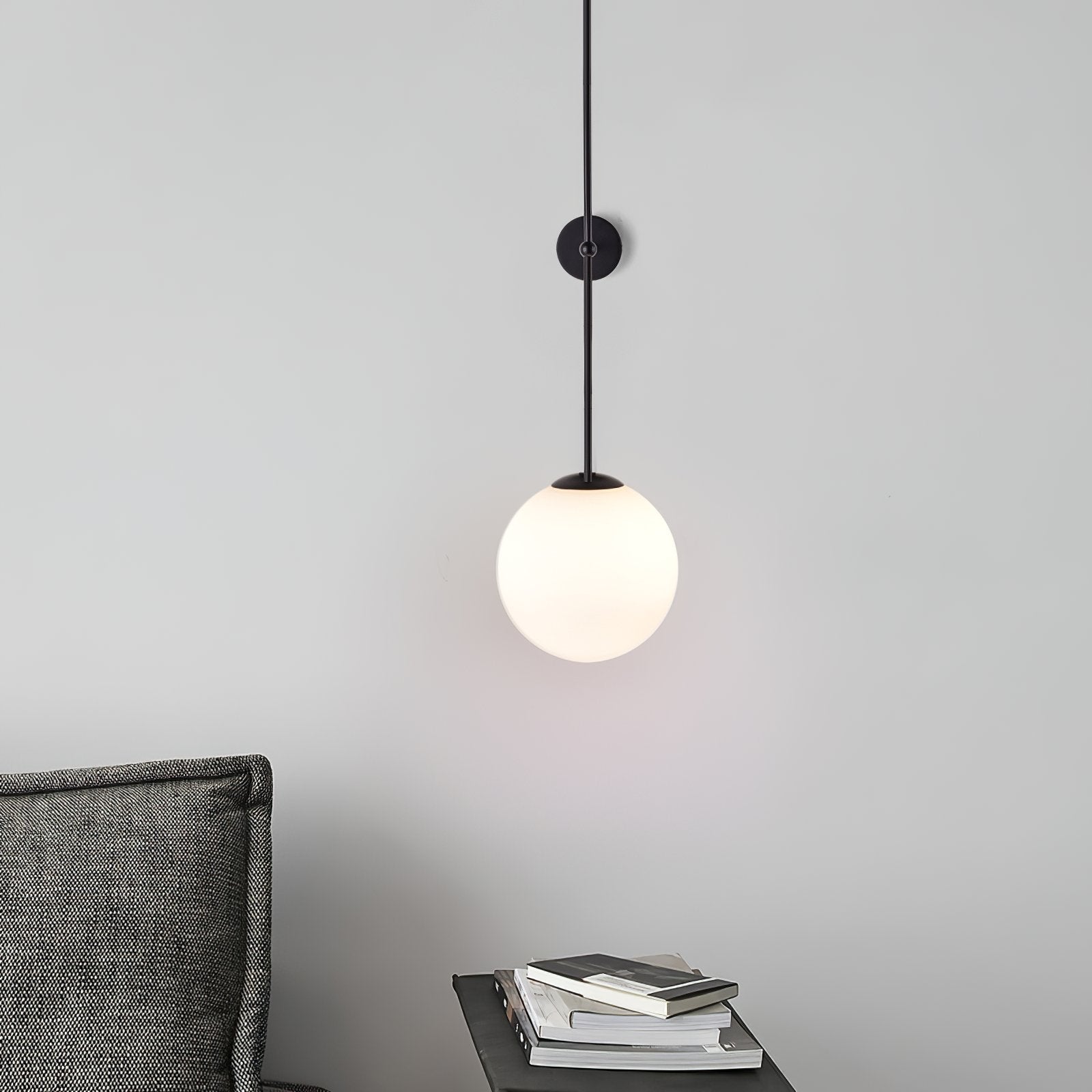 modern-brass-and-opal-glass-sphere-mobile-wall-sconce-lighting-for-indoor-spaces