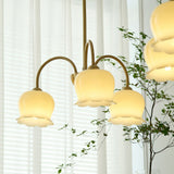 morup-elegant-floral-brass-and-resin-chandelier-with-shimmering-arches-and-cream-accents
