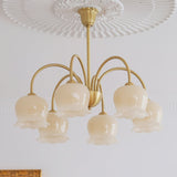 morup-elegant-floral-brass-and-resin-chandelier-with-shimmering-arches-and-cream-accents