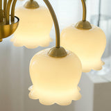 morup-elegant-floral-brass-and-resin-chandelier-with-shimmering-arches-and-cream-accents