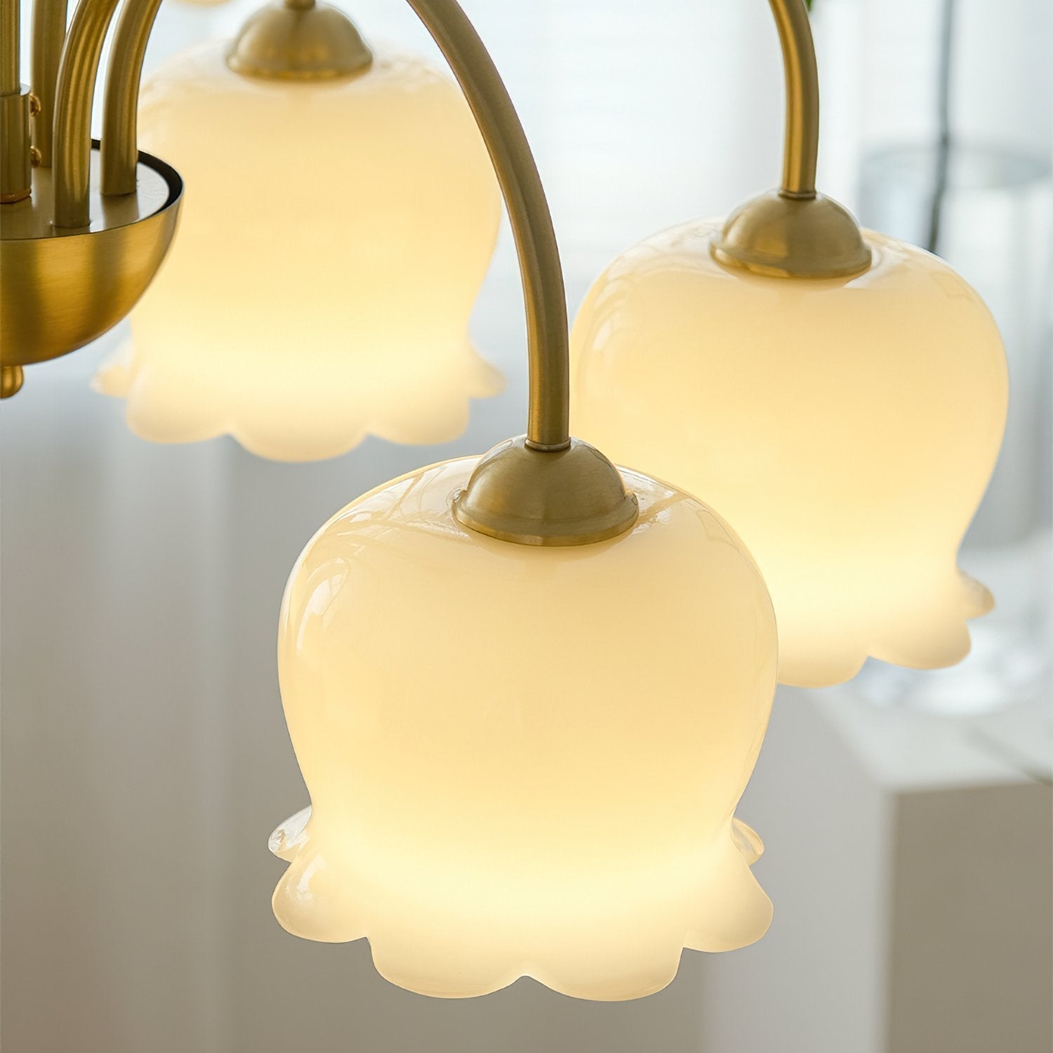 morup-elegant-floral-brass-and-resin-chandelier-with-shimmering-arches-and-cream-accents